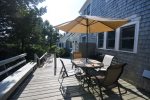 Outdoor dining with outdoor shower and grill